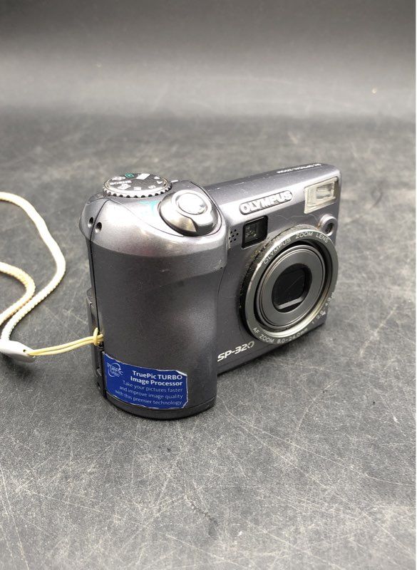 Olympus SP-320 Silver Manual Focus Point & Shoot Digital Camera