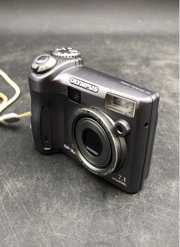 Olympus SP-320 Silver Manual Focus Point & Shoot Digital Camera