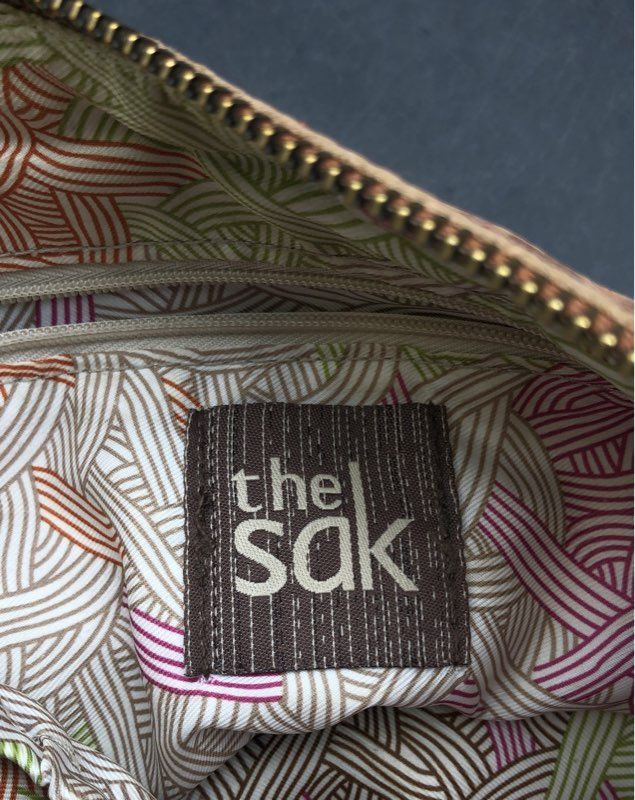 The Sak Cream Pebbled Leather Crossbody Bag Brown Trim Adjustable Canvas Strap