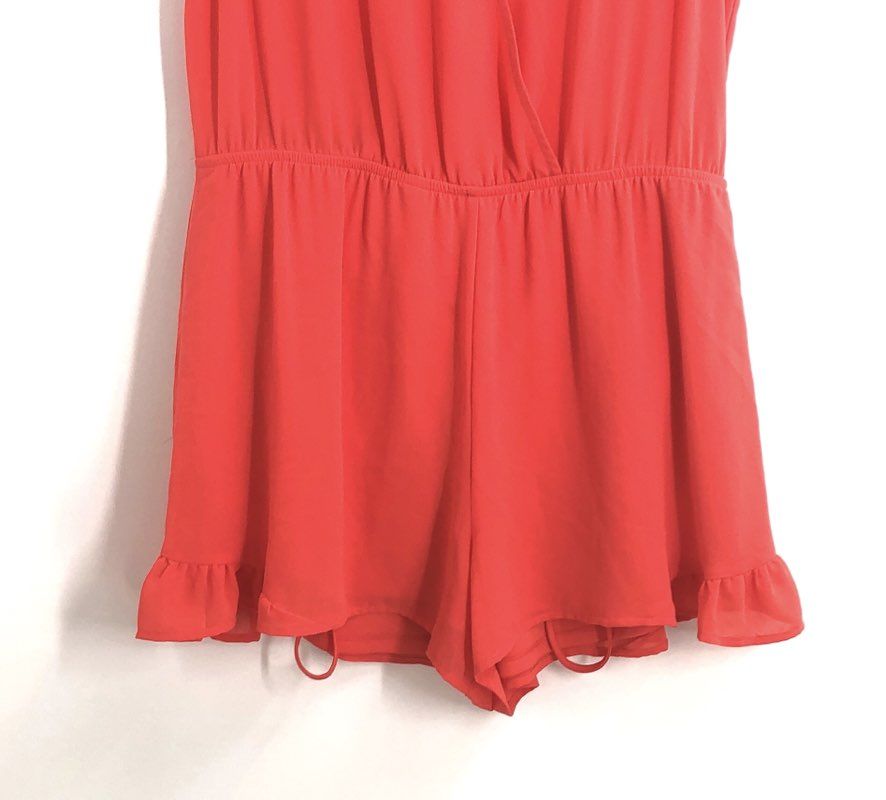 ASTR Women's Coral Surplice Sleeveless Ruffle Hem Tie Back Romper Sz S