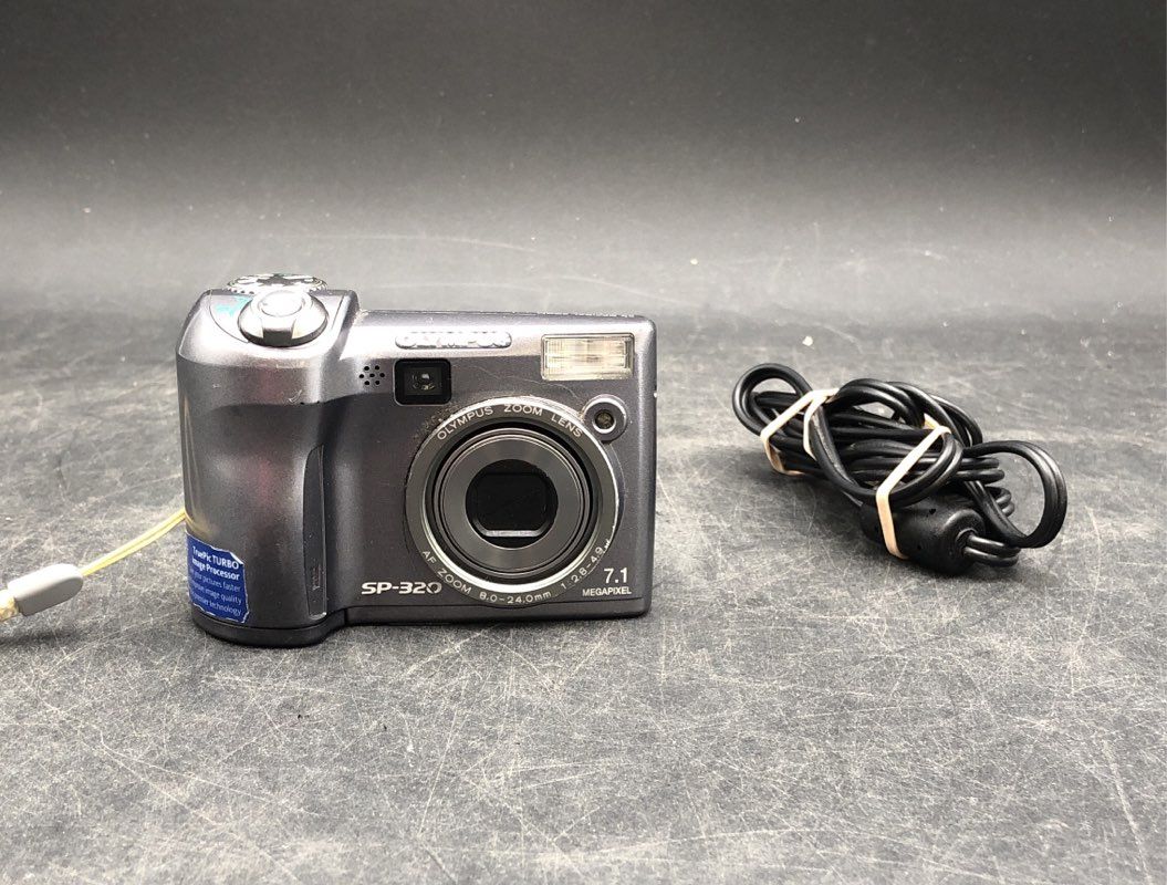 Olympus SP-320 Silver Manual Focus Point & Shoot Digital Camera